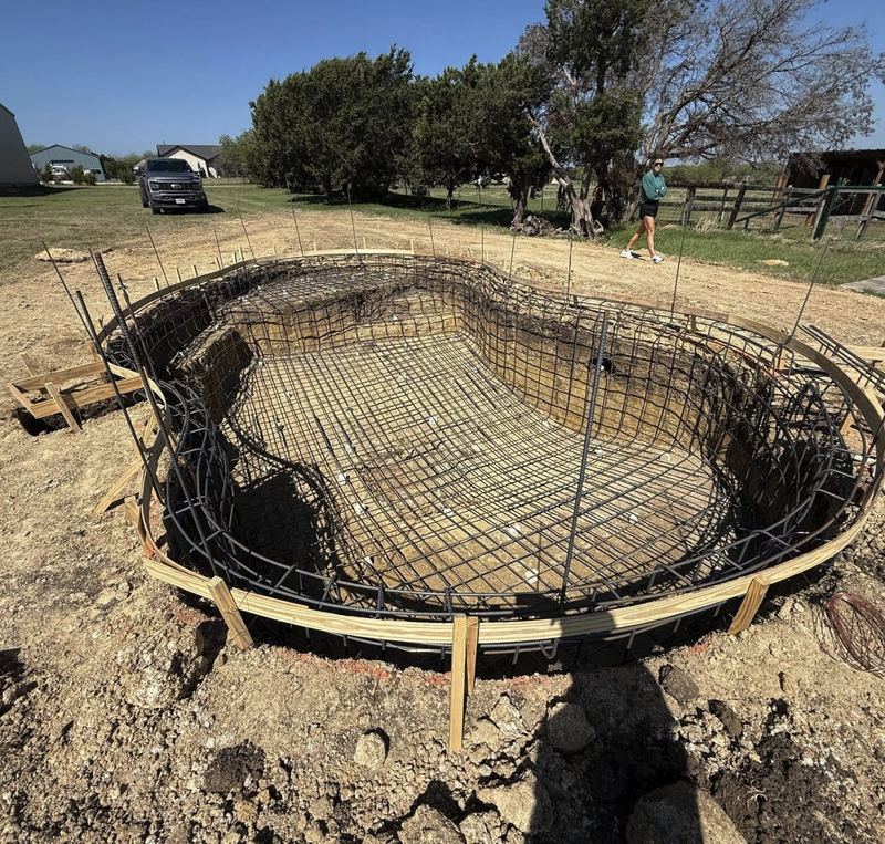 Rebar cage tied on spacers inside a pool excavation