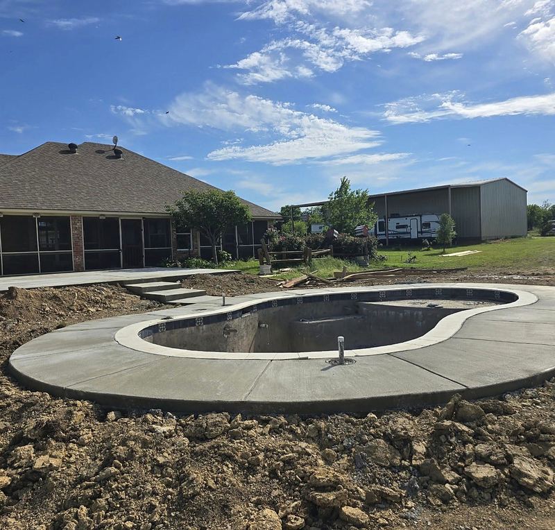 Gunite pool shell with coping set and the deck poured