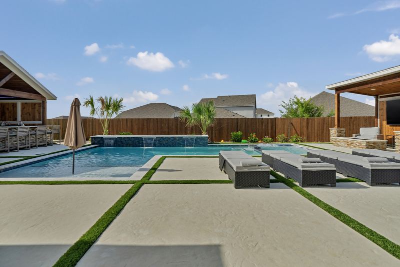 Sheer descent wall with turf inlaid deck
